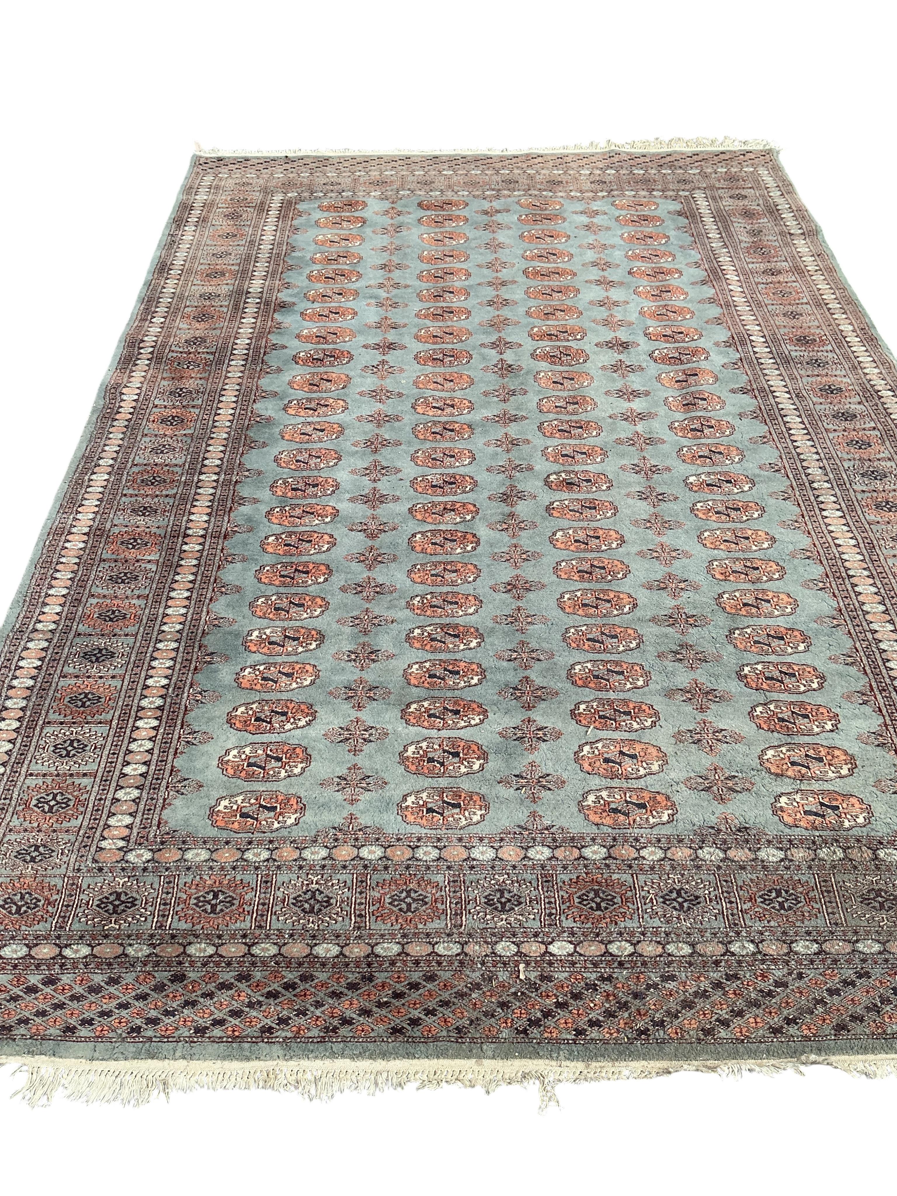 A Bokhara carpet and a smaller Caucasian style rug, larger 290 x 186cm